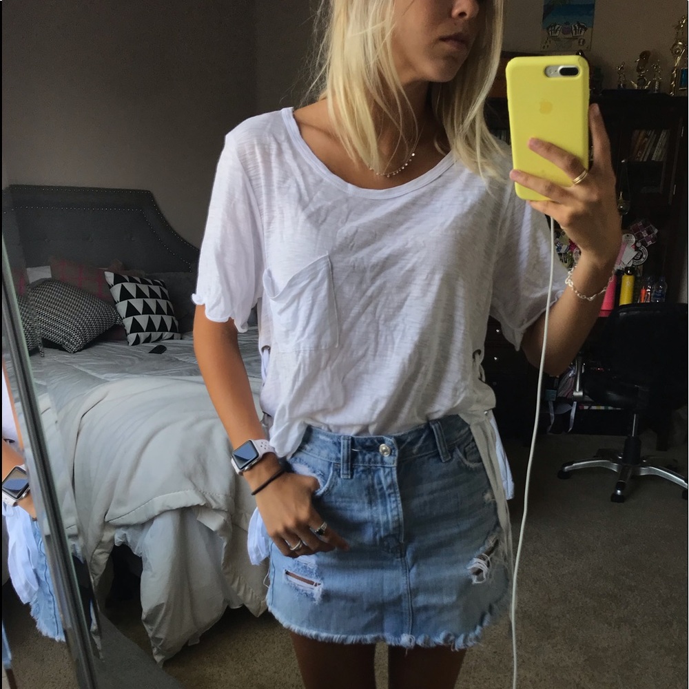 White t-shirt with cross stitching on the side